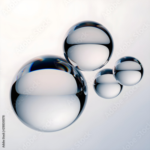 Shiny chrome metal spheres on a smooth light surface