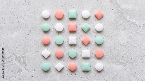 Pastel Geometric Candies and Marshmallows Arranged in Neat Grid Pattern