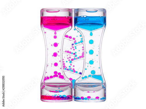 Liquid motion timer oil hourglass with bright pink and blue droplets dripping down a spiral ramp in a clear plastic container, visual sensory toy isolated on black background for stress relief idea.