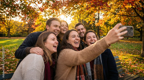 Happy Friends Taking Selfie Together in Autumn Park with Colorful Leaves