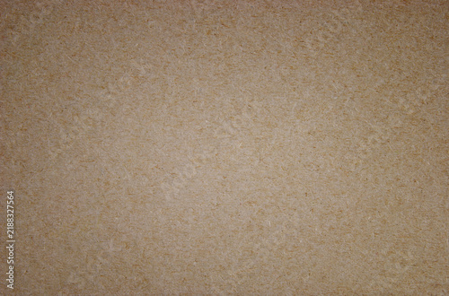 Brown kraft paper texture with natural fibers and vignette effect
