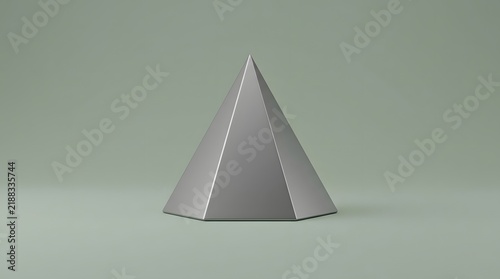 Simple gray geometric pyramid cake topper on a neutral background