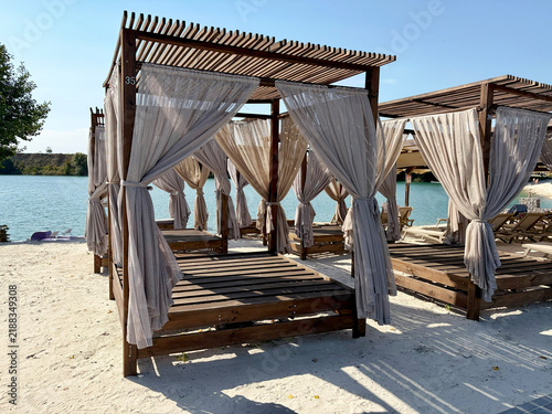Wooden gazebos for relaxation by the riverbank