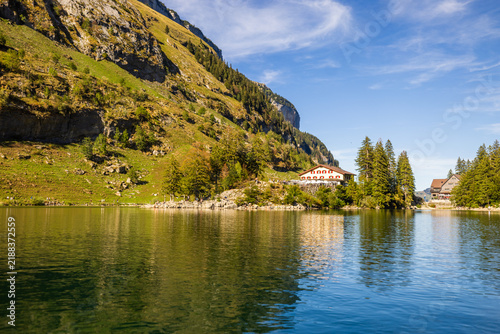 Seealpsee lake with mountain inn Forelle in Alpstein Switzerland