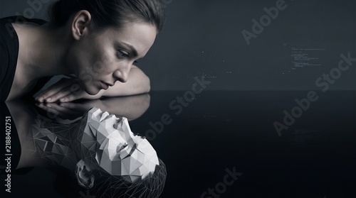 Woman Looking at Low Poly Cybernetic Face Reflection on Dark Surface