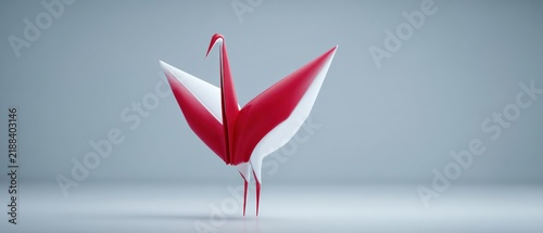 A beautifully crafted origami crane in striking red and white colors set against a simple background representing tranquility and balance in the world of artistic expression and skilled craftsmanship
