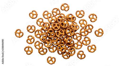 Pile of crunchy mini pretzels scattered on a transparent background for food design projects