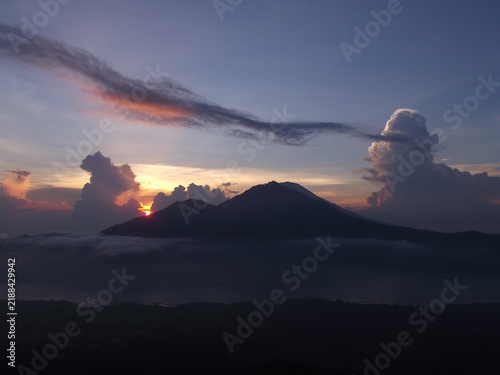 Fotografie Stunning sunrise view over Mount Batur volcano and caldera from Kintamani, Bali,