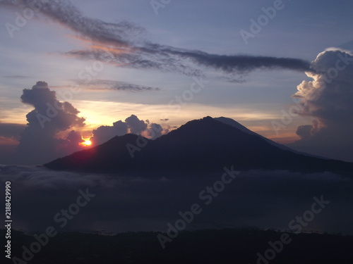 Fotografie Stunning sunrise view over Mount Batur volcano and caldera from Kintamani, Bali,