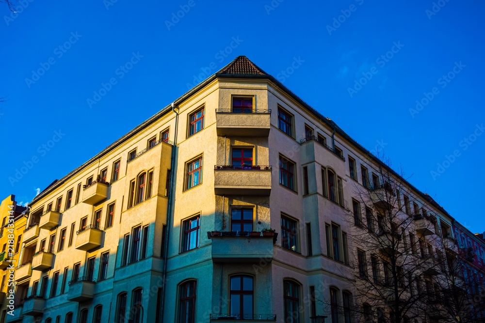 Fototapeta premium Corner apartment building facade with balconies