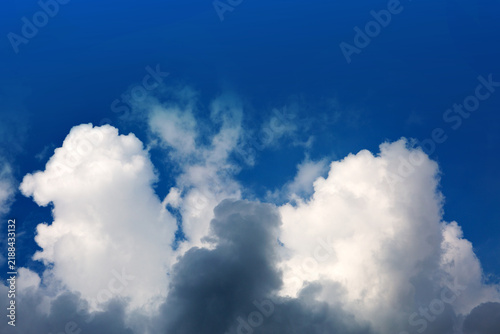 Gray rain clouds and blue sky in summer day.