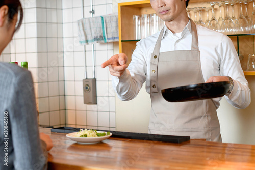 Bild auf Leinwand Angry Japanese Restaurant Manager Scolding Female Employee at Work