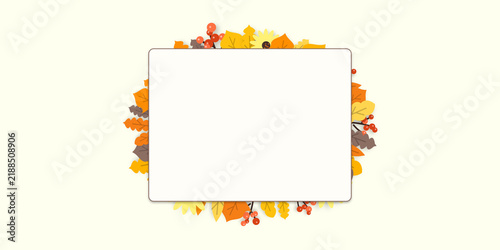 Autumn season background with blank white card surrounded by falling leaves and yellow sunflower for seasonal banner or invitation