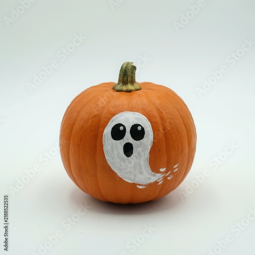 Cute carved pumpkin with ghost face for Halloween decoration