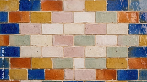 Colorful decorative brick wall with multi colored glazed tiles colorful decorative construction architecture geometric backdrop exterior building material