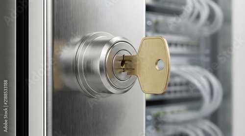 Close-up of a silver secure lock with a golden key on a metallic data cabinet