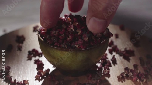 Sichuan red pepper on a wooden tray rotating