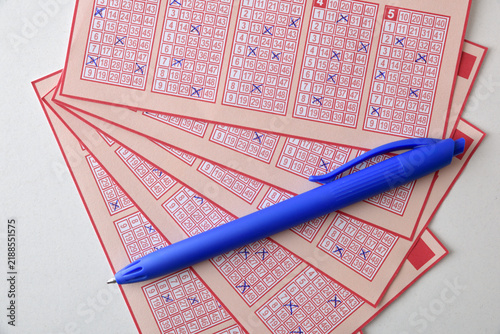 Lottery Tickets and Blue Pen for Number Selection