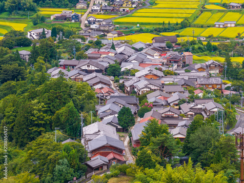 Traditional Japanese houses on the Magome Nakasendo in rural Gifu rice fields and forest