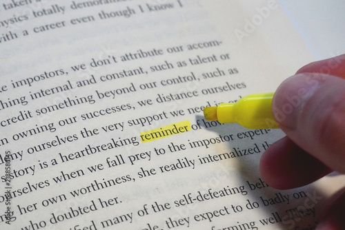 Reminder word highlighted in a book page.