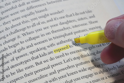 Exposed word highlighted in a book page.