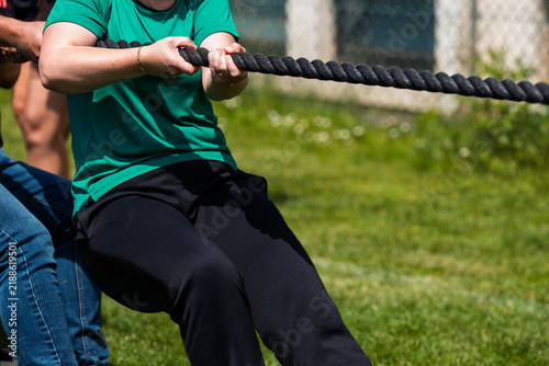 Teamwork and collaboration in outdoor tug of war teambuilding activity