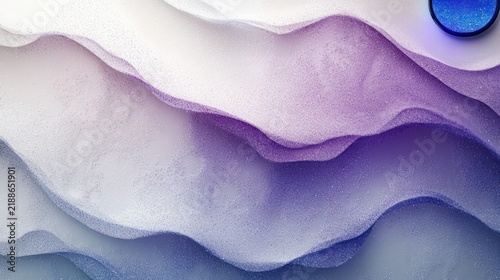 Soft pastel hues swirl gracefully as gentle waves form a calming scene at twilight