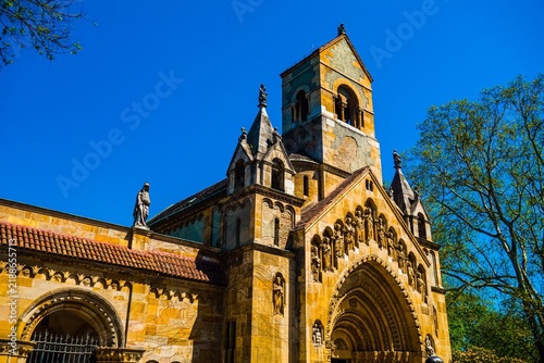 Ornate facade of a historic church against a blue sky