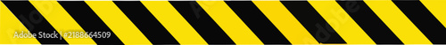 Yellow and black hazard tape barrier strip with diagonal stripes on white background