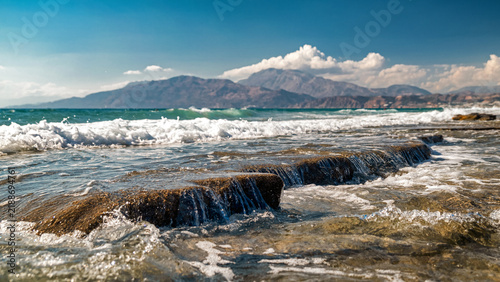 фотографія Libyan Sea waves flowing over coastal rocks near Kalamaki in southern Crete with