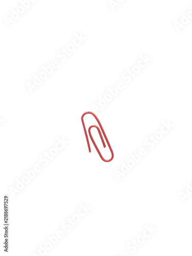 Single red paper clip isolated on white background