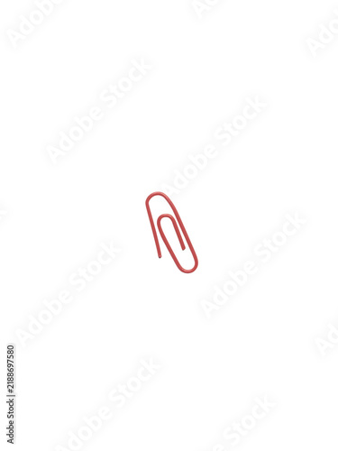 Red metal paper clip isolated on white background