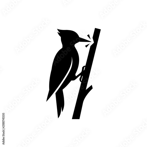 фотографія Black woodpecker silhouette bird pecking tree branch icon for nature education and wildlife conservation themes