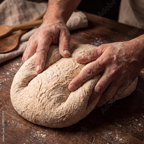 Floured Hands Folding Bread Dough Close Up