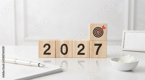Cup of Coffee and new year 2027 on Wooden Table with Business News, Communication and Success Concept