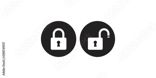 Фотография Dark circular icons featuring a locked and unlocked padlock for security