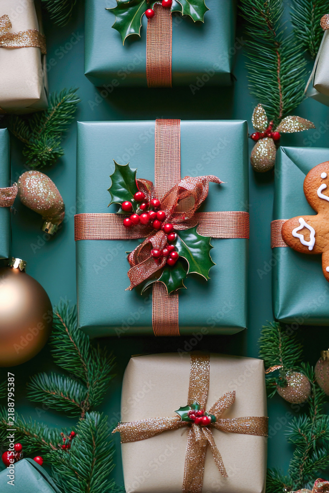 Obraz premium Group of gifts wrapped in green paper, perfect for holiday season ideas and promotions. vertical frame