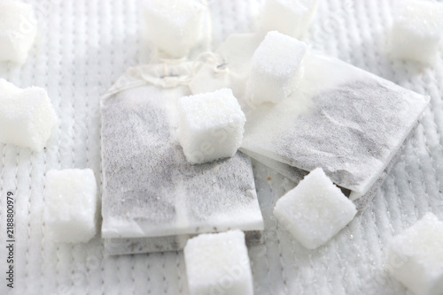 Obraz na plátně White sugar cubes and tea bags for a sweet drink.