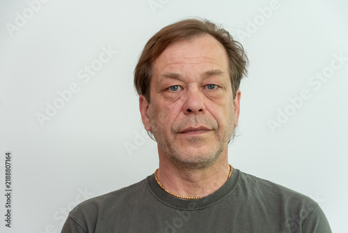 Isolated middle aged man with neutral expression on white background