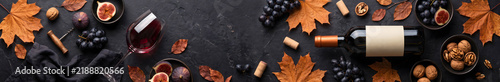 Red Wine Harvest Banner with Bottle, Glass, Autumn Foliage, and Nuts