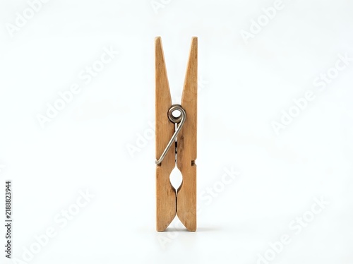 Wooden clothespin with metal spring mechanism isolated on white background