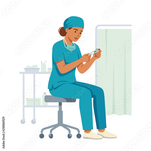 Caring Nurse Concentrates on Patient Care Tools in Medical Setting