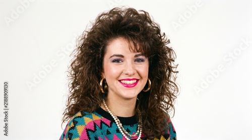Young Woman with Big Curly Hair and 1980s Fashion Style