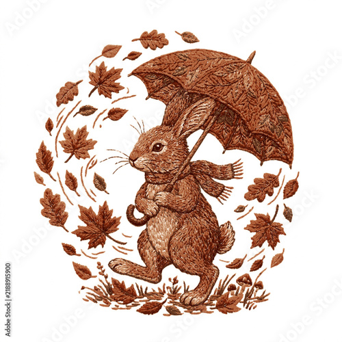A detailed hand embroidered brown rabbit holding an umbrella walking through falling autumn leaves with intricate embroidery art
