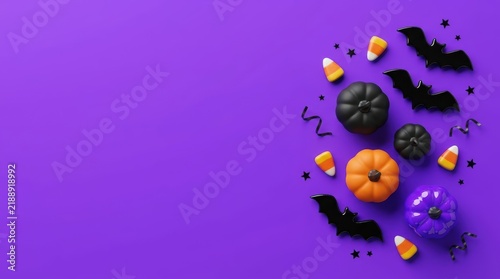 Minimalist Halloween flatlay banner with pumpkins, bats, and candy corn on purple background with copy space. Playful spooky holiday campaign background for advertising.