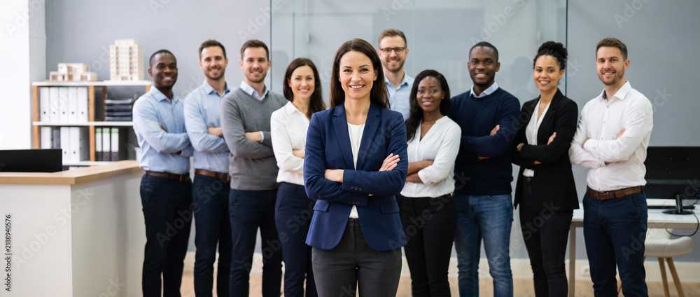 Obraz premium Property manager leads diverse residential management team, highlighting leasing, tenant services, maintenance coordination, property administration and professional real estate operations.