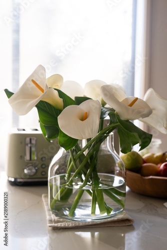 white lilies in a vase at home