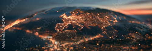 Earth planet glowing night city lights Europe map network digital technology concept