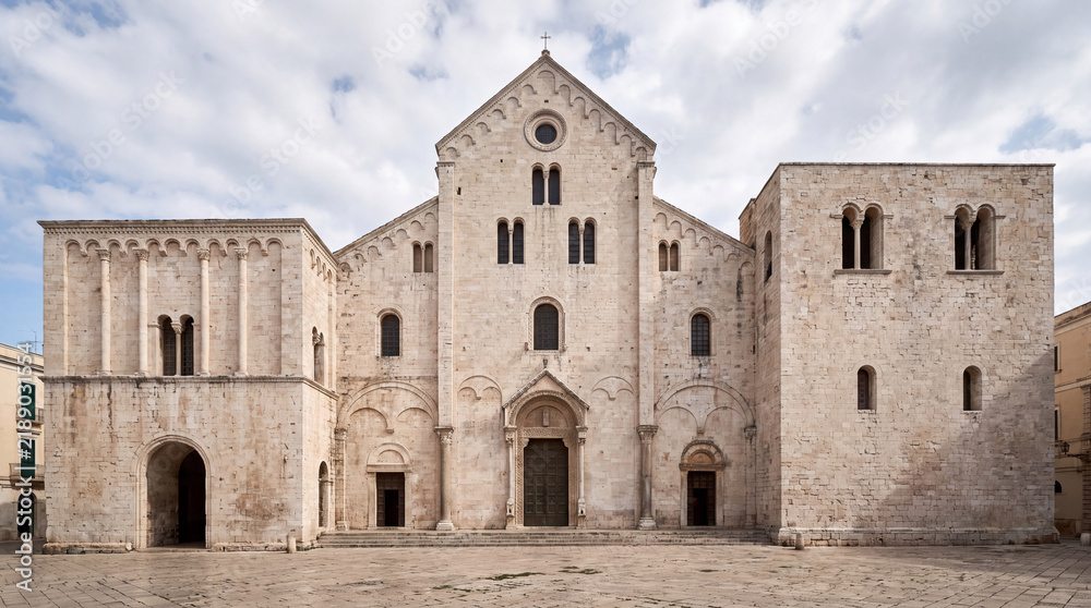 Obraz premium A frontal view of the ancient Romanesque Cathedral of San Sabino, an iconic stone church located in the historic center of Bari, Puglia, Italy.