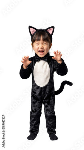 Cute Asian girl making a scary face in a Halloween black cat costume